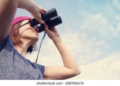 Girl With The Binoculars  Against The Sky. Observation Of Birds. Birdwatching