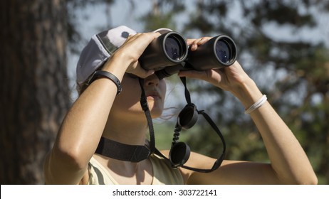 A Girl Birdwatching With Binoculars 