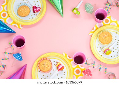 Girl Birthday Pink Table Setting From Above With Muffins, Drinks And Party Gadgets. Background Layout With Free Text Space.