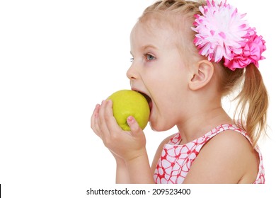 Girl Biting An Apple Mouth Wide Open.The Concept Of Childhood And Child Development