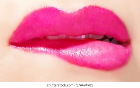 Girl Biting Glossy Pink Lips Close Up 