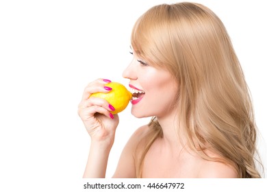 Girl Biting A Lemon