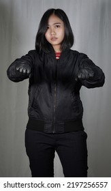 Girl In Black Bomber Jacket And Leather Gloves