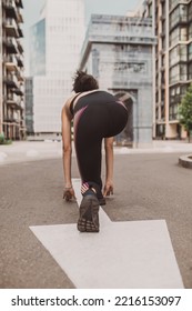 Girl In Black Sportswear Standing On The Start Of A Running Route