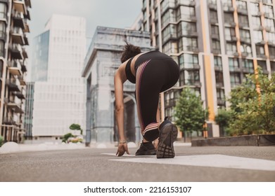 Girl In Black Sportswear Standing On The Start Of A Running Route