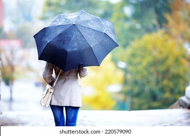 The Girl With A Black Umbrella Costs In The Rain