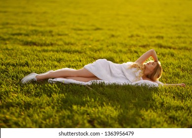 Beautiful Baby Sitting On Blanket At Sunset Stock Photo Download