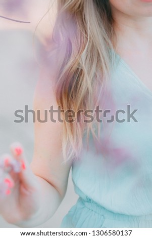 Similar – Image, Stock Photo Young woman wearing a flower shirt and using her phone