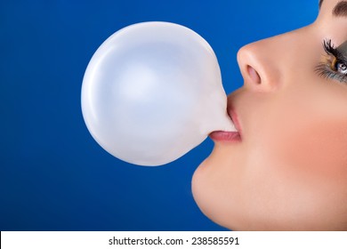 Girl Blowing A Big Bubble Gum Bubble