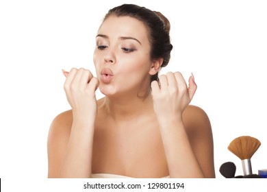 Girl Blowing And Drying Her Nail Polish On The Nails