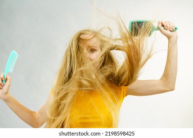 Girl With Blowing Long Blonde Hair Holding Brush And Comb. Haircut, Haircare Concept.