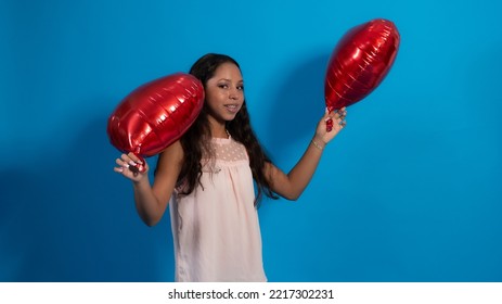 Girl With Blue Background, Holding Heart Balloons 