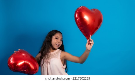 Girl With Blue Background, Holding Heart Balloons 