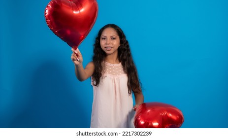 Girl With Blue Background, Holding Heart Balloons 