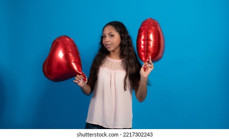 Girl With Blue Background, Holding Heart Balloons 