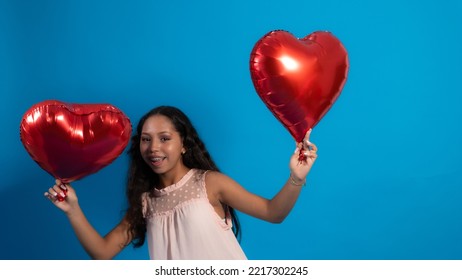 Girl With Blue Background, Holding Heart Balloons 