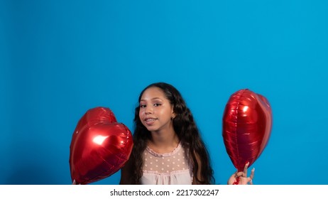 Girl With Blue Background, Holding Heart Balloons 