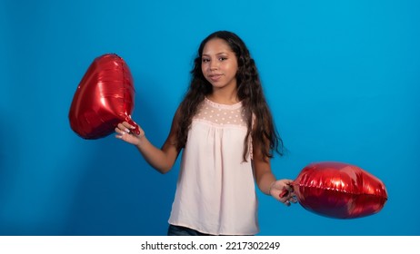 Girl With Blue Background, Holding Heart Balloons 