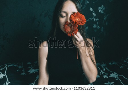 Similar – a girl with blue eyes and long hair with a beard of gerbera flowers