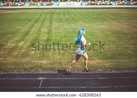 Similar – Foto Bild Junger Mann fährt auf dem Skate und hält Surfbrett.