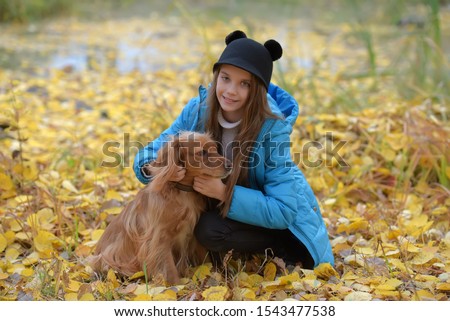 Similar – Foto Bild Herbstporträt eines glücklichen Kindes Mädchens, das mit ihrem Hund spielt.