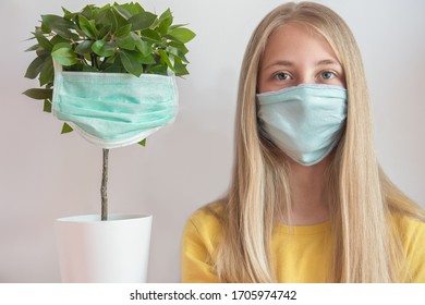 The girl and the Bonsai tree wear Medical Face Masks during the coronavirus covid-19 pandemy.Ecology, air pollution and health care concept. - Powered by Shutterstock