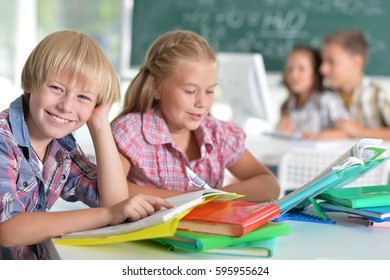 Girl and boy doing lessons