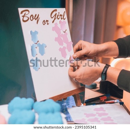 A girl or boy sign on board. gender reveal party
