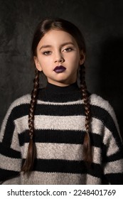 A girl with braids in a gothic style on a dark background - Shutterstock ID 2248401769