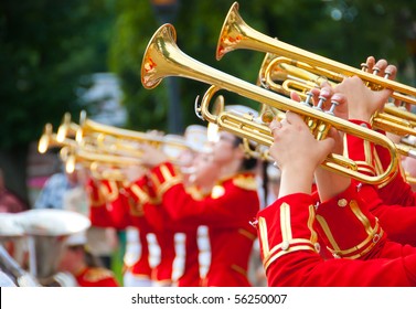 Girl Brass Band in red uniform performing