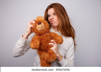 girl breaks teddy bear