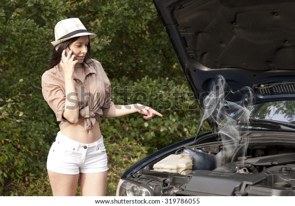 girl with broken car on the\
road