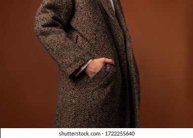 Girl In A Brown Coat With A Hand In His Pocket