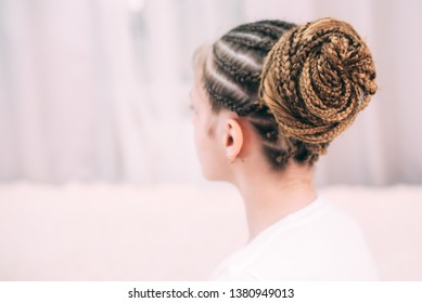 Girl With Brown Hair And Pigtails Braided With Artificial Hair Braiding