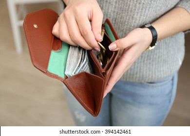 Girl With Brown Wallet Full Of Money