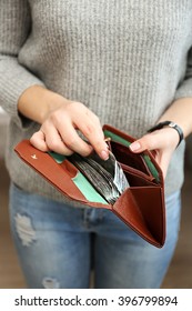 Girl With Brown Wallet Full Of Money