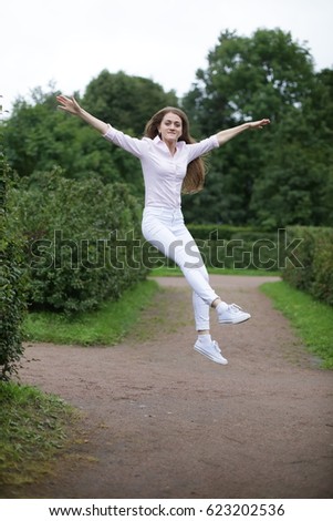 Similar – beautiful young woman having fun outside in park