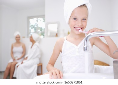 Girl brushing teeth at a spa