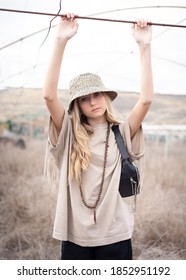 Girl With Bucket Hat And Fanny Pack.