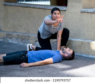 Girl Calling Emergency Service For An Unconscious Guy