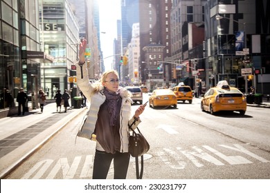 Girl Calling Taxi Cab In New York City