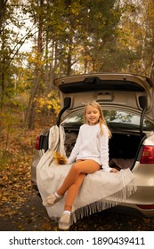 Girl In The Car In Autumn