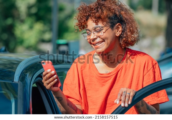 girl in the car with mobile\
phone