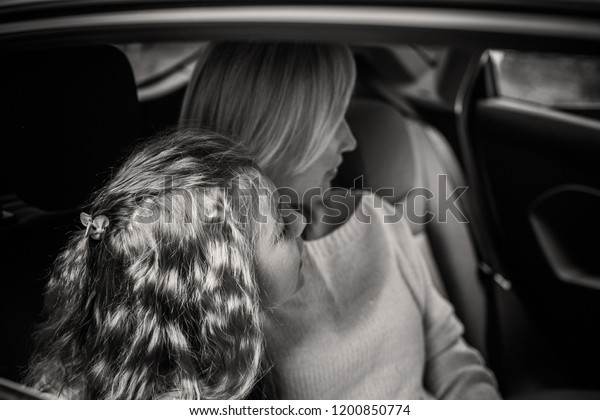 Girl in car with mother, Family traveling\
concept on countryside