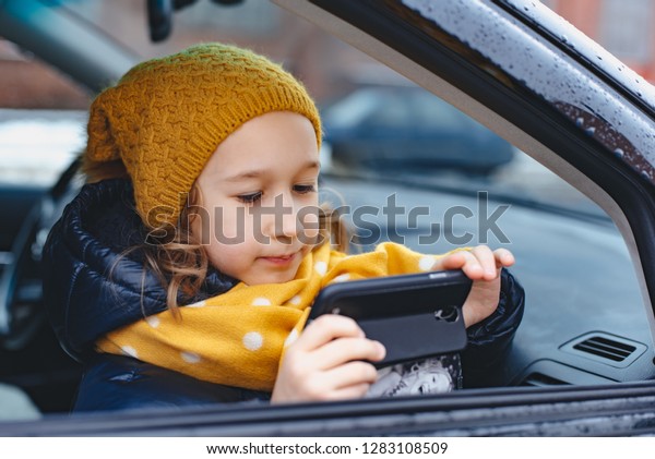 girl in the car with the\
phone