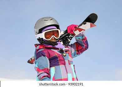 Girl Carrying Skis