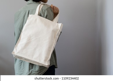 Girl Carrying Totebag On Gray Background 