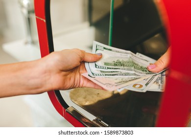 Girl changes dollars in exchange of currencies.exchange rate