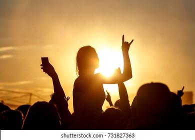 Girl Cheering At Outdoor Music, Rock Festival