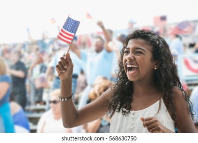 Girl Cheering And Waving American Flag